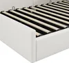 Close-up view of the side and slatted base of a white upholstered bed frame. Anteprima dell’immagine prodotto
