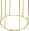Close-up of the base of a gold-colored plant stand. Produktbild-Vorschau