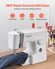 A white sewing machine is shown on a wooden table, with a pair of jeans being sewn. The background features text and icons highlighting the product's features, and a rack of colorful thread spools. Voir les images du produit