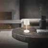 A modern living room scene with a coffee table, fireplace, and a bench. Anteprima dell’immagine prodotto