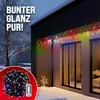 Christmas lights on a house exterior during winter. Produktbild-Vorschau