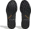 The soles of two black Adidas Terrex Swift R2 GTX hiking shoes are shown from an underneath view against a white background. Náhled obrázku produktu