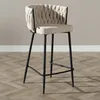 A bar stool is shown in a studio setting against a plain wall and on a wooden floor. Produktbild-Vorschau
