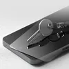 A clear screen protector for a phone is shown with a key resting on it. Produktbild-Vorschau