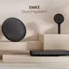 A black shower system with a round showerhead, a handheld showerhead, and a control panel is displayed on a tiered platform against a light background. Produktbild-Vorschau