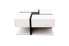 A modern coffee table with a geometric design. Voir les images du produit
