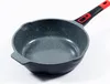 A frying pan with a speckled interior and a black and red handle, set against a white background. Produktbild-Vorschau