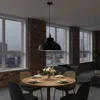 A dining room scene with a pendant light hanging over a wooden table set for a meal. Produktbild-Vorschau