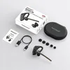 A flat lay of a Bluetooth headset and its accessories, including the packaging, charging cable, and ear tips, arranged on a light gray surface. Produktbild-Vorschau