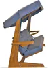 A wooden garden swing with gray cushions and a gray canopy, shown against a white background. Podgląd zdjęcia produktu