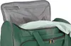 A close-up view of an open green duffel bag with a light green towel inside. Anteprima dell’immagine prodotto