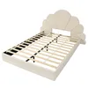 A beige upholstered bed frame with a scalloped headboard and wooden slats for a mattress, shown from a diagonal angle against a white background. Produktbild-Vorschau