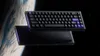 A keyboard is shown floating in space with Earth in the background. Produktbild-Vorschau