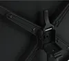A close-up view of the underside of a black folding table, showing the central mechanism and support legs. Produktbild-Vorschau
