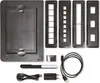 A collection of accessories for a scanner, including a large flat scanning bed, several film holders, a USB cable, and a power adapter, laid out on a white background. Produktbild-Vorschau