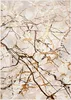 A close-up of a marble-patterned rug with gold and brown veining. Voir les images du produit