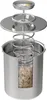 A cutaway illustration of a stainless steel ham cooker with a thermometer and internal spring mechanism, showing the food inside. Podgląd zdjęcia produktu