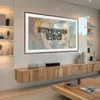 A modern living room with a large TV mounted on the wall above a wooden media console. Anteprima dell’immagine prodotto