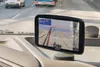 A GPS navigation device mounted on a car dashboard, showing a route on a map. Voir les images du produit