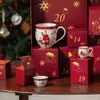 A Christmas-themed advent calendar with mugs and small boxes arranged on a wooden table, with a blurred Christmas tree in the background. Produktbild-Vorschau