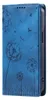 A blue flip phone case with a dandelion design. Produktbild-Vorschau