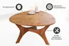 A wooden coffee table with candles on top, set in a well-lit room. Produktbild-Vorschau