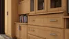 A close-up view of a wooden cabinet with drawers and a bookshelf. Produktbild-Vorschau