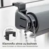 Close-up of a gray roller blind clip attached to a window frame, with a smaller inset image showing the clip and a measurement indicator. Produktbild-Vorschau