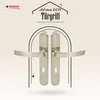A marketing image showcasing a pair of door handles against a patterned background. Produktbild-Vorschau