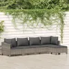 A sectional outdoor sofa set with dark gray cushions is placed on a wooden deck in front of a white slatted fence covered in green ivy. Produktbild-Vorschau