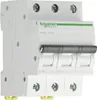 A white electrical circuit breaker with a gray handle and green branding. Anteprima dell’immagine prodotto