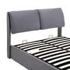 Close-up view of a bed frame with a grey upholstered headboard and wooden slats. Anteprima dell’immagine prodotto