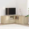 A corner TV stand with a television on top, placed in a room with white walls and a light-colored rug. Podgląd zdjęcia produktu