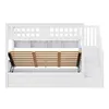 A white bunk bed with a slatted mattress base lifted to reveal storage space underneath. Stairs are visible on the right side. Náhled obrázku produktu