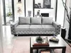 A modern living room with a gray sofa and a coffee table. Produktbild-Vorschau