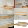 A collage of images showing a wooden wall-mounted cat bed with a white cushion. Produktbild-Vorschau