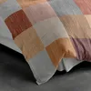 A close-up of a comforter with a patchwork design. Produktbild-Vorschau
