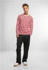A man is standing and posing for a product shot. Produktbild-Vorschau