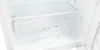 The inside of a clean, white refrigerator with clear plastic drawers. Produktbild-Vorschau