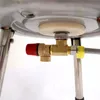 Close-up view of plumbing fittings attached to a water heater. Produktbild-Vorschau