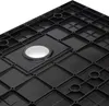 The underside of a black shower tray with a grid-like structure and a circular drain opening. Produktbild-Vorschau