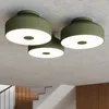 Three green ceiling lights mounted on a concrete ceiling. Produktbild-Vorschau
