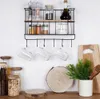 A kitchen shelf with various items like spice jars, mugs, and decorative wood slices. Anteprima dell’immagine prodotto