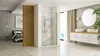 A modern bathroom and bedroom suite with a shower enclosure, vanity, and bed. Anteprima dell’immagine prodotto