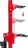 A close-up of a red hydraulic spring compressor with a chain mechanism, showing adjustable arms and a downward arrow indicating movement. Anteprima dell’immagine prodotto