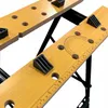 Close-up view of a wooden workbench with black accessories and markings. Náhled obrázku produktu