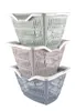 Three stacked plastic shopping baskets in different colors. Náhled obrázku produktu
