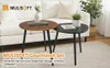 Two round coffee tables with metal legs are placed in a living room setting in front of a sofa. Produktbild-Vorschau