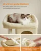 A cat is resting on a cat tree platform, with close-up images showing the removable cushion and hand-washing instructions. Produktbild-Vorschau