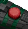 A close-up view of a red knob on a green and black power tool. Produktbild-Vorschau